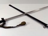 two swords that are laying on a table