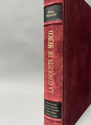 a red book sitting on top of a white table