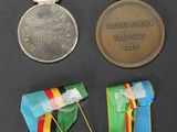 many medals and medals on display on a table