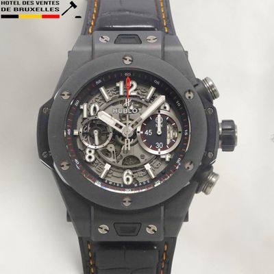 the watch is black and has a black strap around it