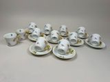 a group of cups and saucers sitting on top of a table
