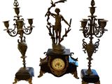 three different types of clocks on display on a white background