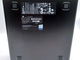 a close up of a laptop with a battery on top of it