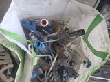 a bag full of tools sitting on the ground