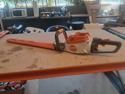 a chainsaw sitting on a table in an office