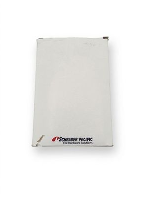 a close up of a piece of white paper on a white surface