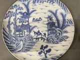 a plate with a blue and white design on it