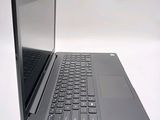 a laptop computer sitting on top of a white table