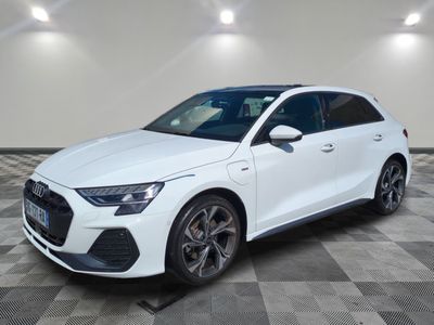 a white audi suv parked on a checkered tile floor