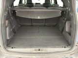 the back of a car with the trunk open and the seats down