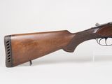 an old gun with a wooden barrel and a wooden handle