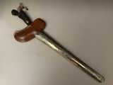a picture of a knife with a wooden handle on a table