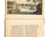 an open book with a picture of a boat in the water