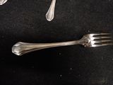 a fork and a spoon sitting on a table