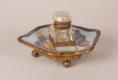 a small glass bottle sitting on top of a tray