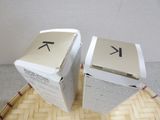 two boxes that are sitting next to each other on a table