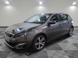 a picture of a grey car in a showroom
