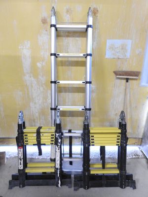 a ladder that is next to a bench in a room