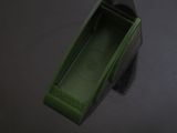a green box that is sitting on a table
