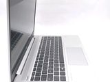a laptop computer sitting on top of a white table