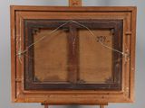 an old wooden easel with a painting on top of it