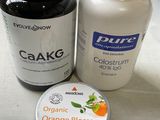 a bottle of orange blossom and a jar of shea balm on a counter