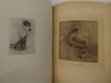 an open book with a drawing of a woman sitting on a chair