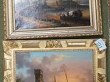 two framed paintings of boats in a harbor with a castle in the background