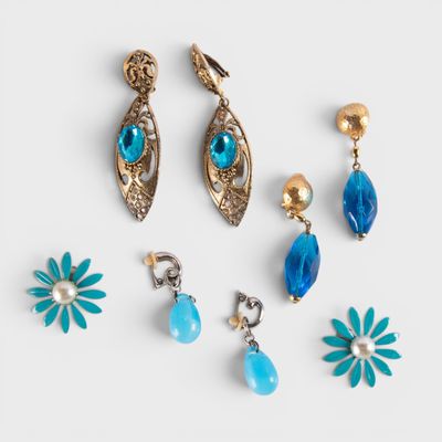 a set of five pairs of blue and gold earrings
