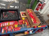 many different types of tools in a box on a table