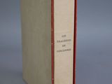 an old book sitting on top of a table next to a gray background