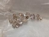 a lot of diamonds that are laying on a table
