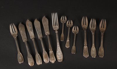 a lot of forks and spoons sitting on a table