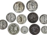 an image of a group of old coins on a white surface