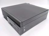 an image of a black desktop computer sitting on top of a white surface