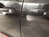 a close up of a car door handle on the side of the car