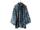 an image of a blue fur coat hanging on a hanger