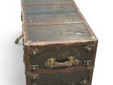 an old suitcase sitting on top of a white surface