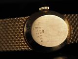 an image of a close up of a wrist watch on a table