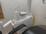 an image of a dental room with a sink and a chair