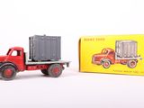 a toy truck with a container on the back of it