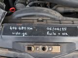 a close up of a car ' s engine with a sticker on it