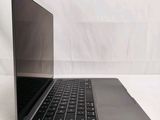a laptop computer sitting on top of a white table