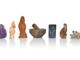 a group of small figurines of different shapes and sizes