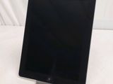 an image of a black tablet computer sitting on top of a table