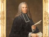 portrait of a man holding a book and a book in his right hand