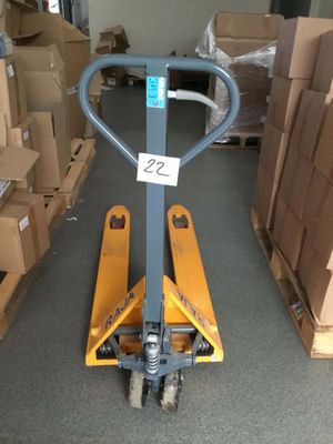 a fork lifter that is sitting in the middle of a room
