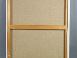 an old wooden frame with a canvas on it