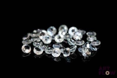 an image of a bunch of white diamonds on a black surface