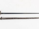 an old sword with a wooden handle on a white surface